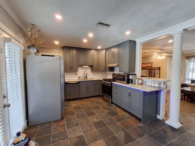 kitchen with kitchen peninsula, stainless steel appliances, gray cabinetry, and sink