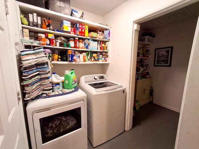 clothes washing area featuring washing machine and clothes dryer