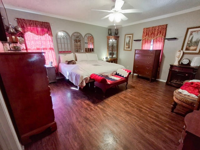 bedroom with ceiling fan, crown molding, and dark hardwood / wood-style floors