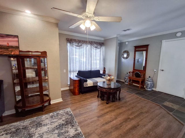 living room featuring ornamental molding, ceiling fan, and dark wood-type flooring