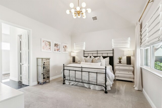 carpeted bedroom with vaulted ceiling, baseboards, visible vents, and a chandelier