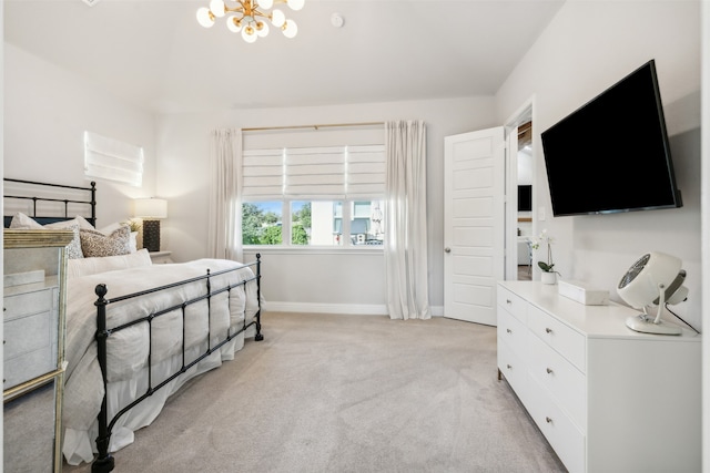 bedroom featuring light carpet, a notable chandelier, and baseboards