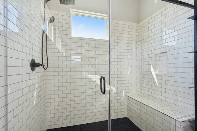 bathroom with a shower stall