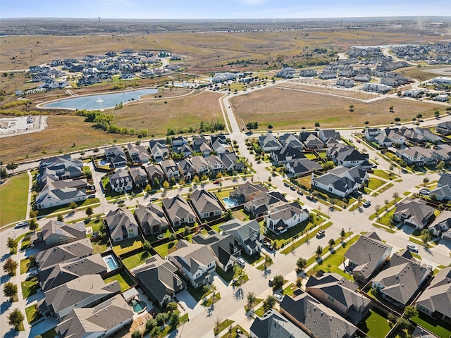 birds eye view of property featuring a residential view and a water view