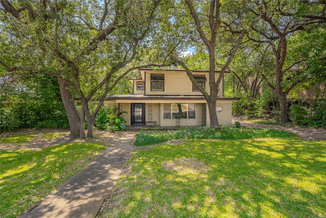 view of front property with a porch and a front lawn