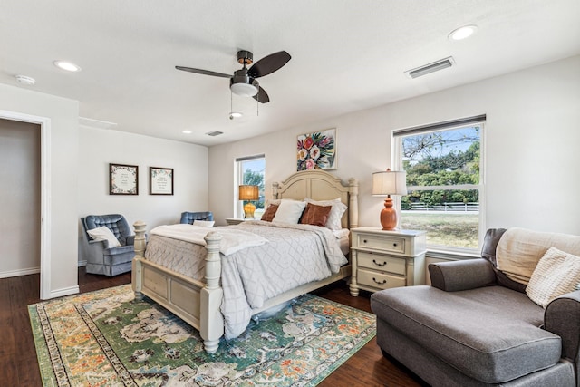 bedroom featuring ceiling fan and dark hardwood / wood-style floors