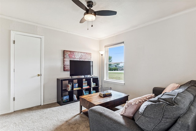 carpeted living room with crown molding and ceiling fan