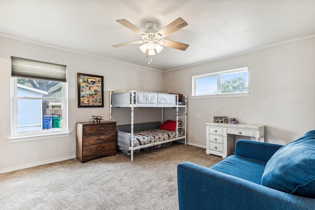 bedroom with ceiling fan, light colored carpet, and ornamental molding