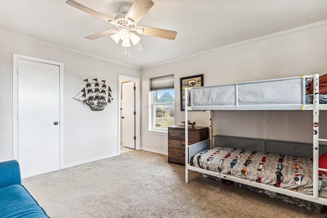 carpeted bedroom featuring ornamental molding and ceiling fan