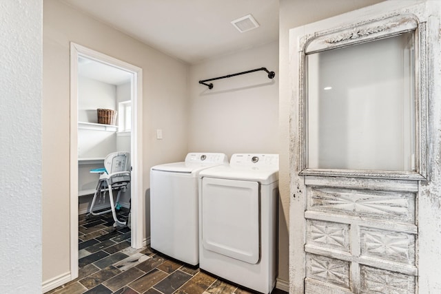 clothes washing area featuring washing machine and clothes dryer