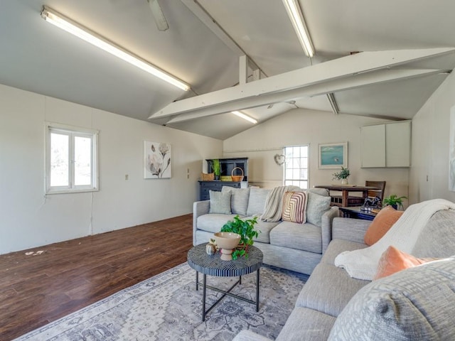 living room featuring hardwood / wood-style floors and vaulted ceiling with beams