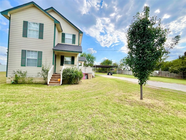 view of front of home with covered porch and a front lawn