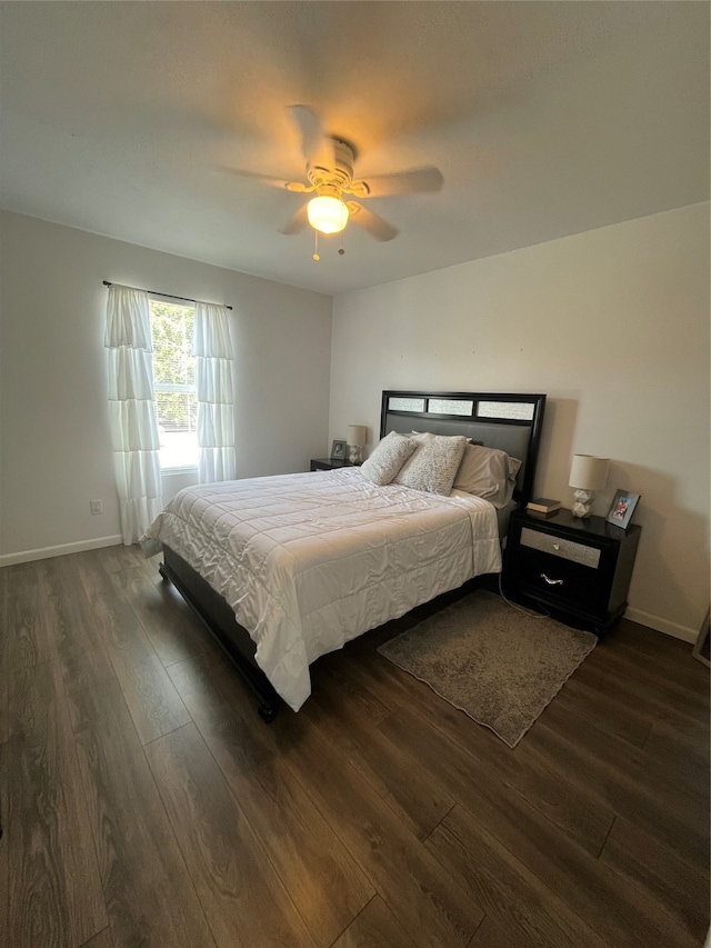 bedroom featuring dark wood-type flooring and ceiling fan