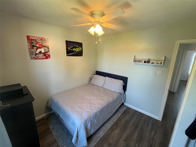 bedroom featuring dark hardwood / wood-style flooring and ceiling fan