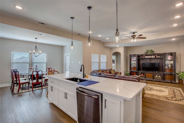 kitchen with sink, an island with sink, white cabinetry, and dark hardwood / wood-style flooring