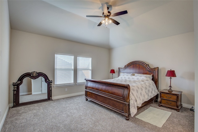 bedroom with ceiling fan, carpet flooring, and vaulted ceiling