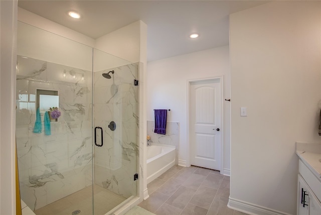 bathroom with vanity, independent shower and bath, and tile patterned flooring