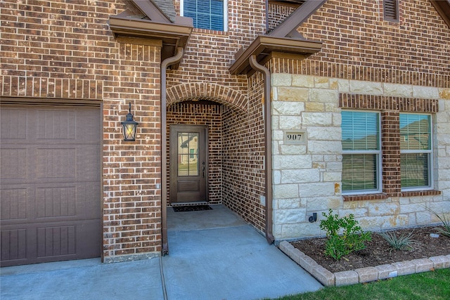 entrance to property featuring a garage