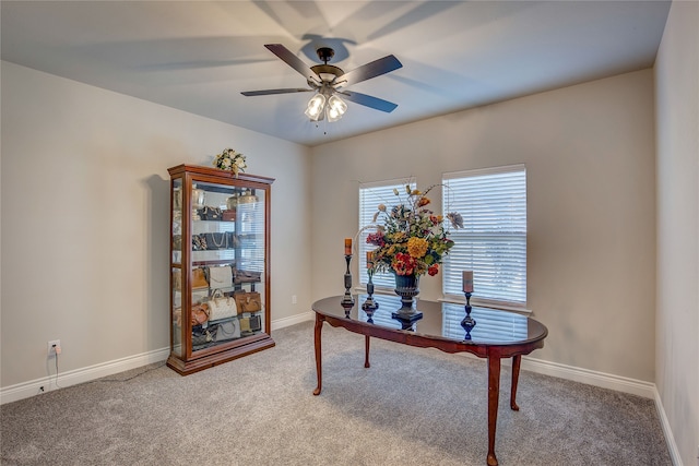 carpeted office with ceiling fan