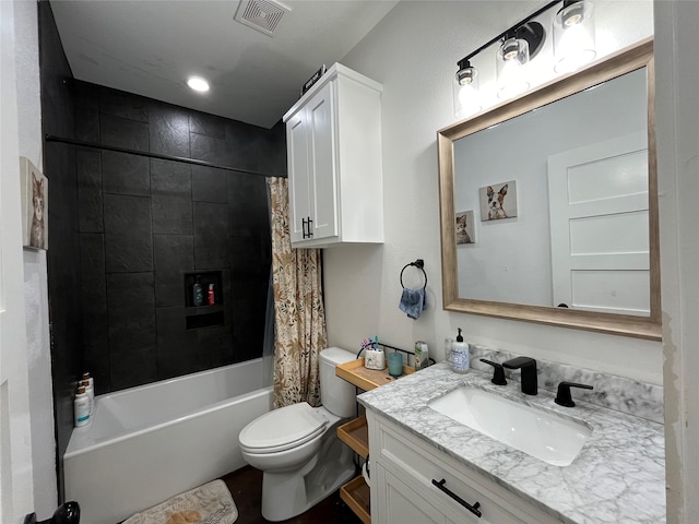 full bathroom with vanity, toilet, and shower / tub combo