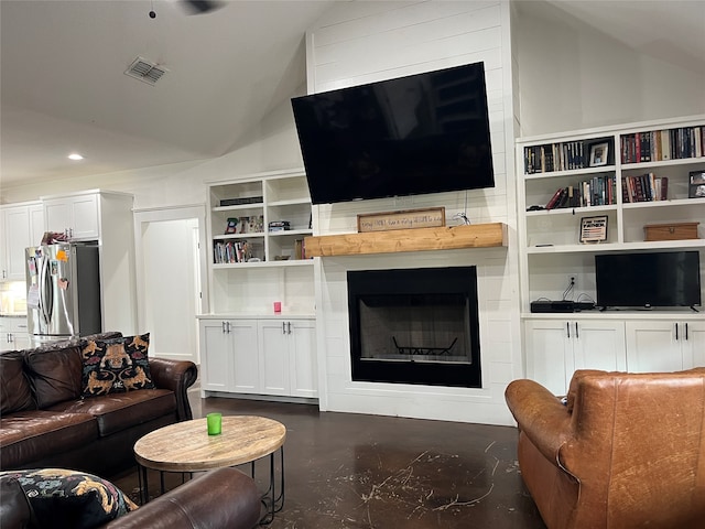 living room with lofted ceiling and a fireplace