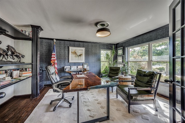 office space with hardwood / wood-style floors, a textured ceiling, and crown molding