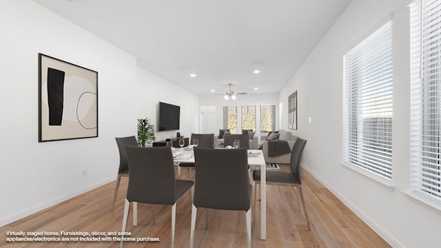 dining space with light hardwood / wood-style floors