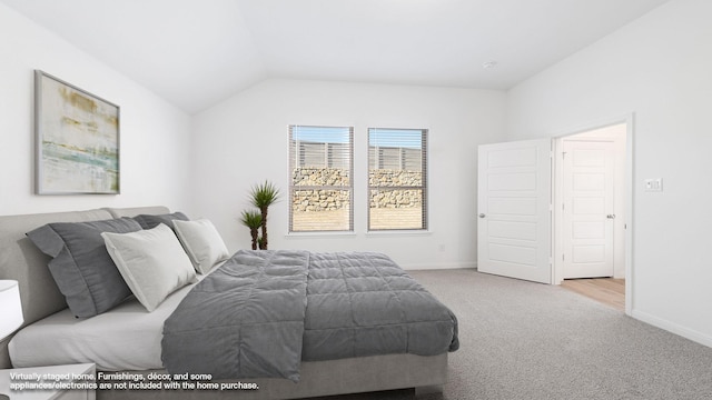 carpeted bedroom featuring vaulted ceiling