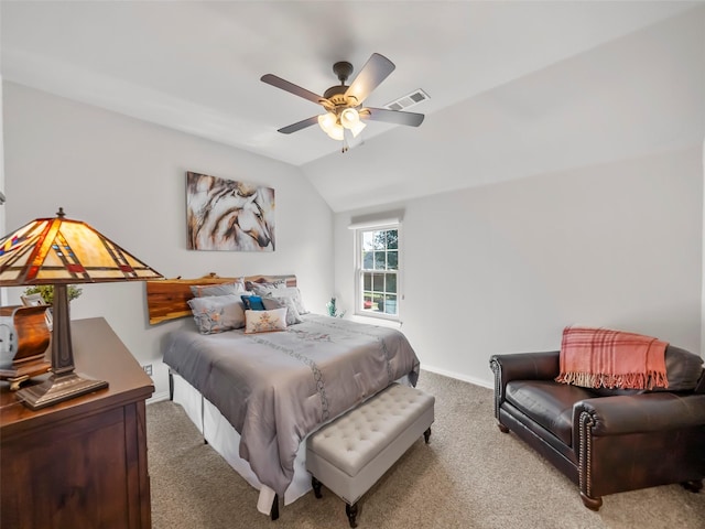 bedroom with ceiling fan, lofted ceiling, and light carpet