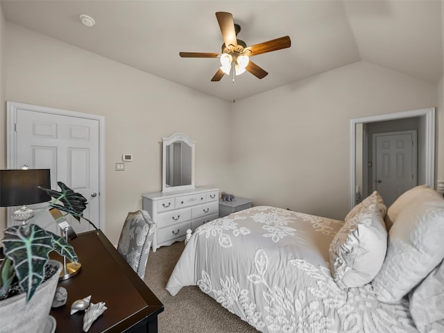 bedroom featuring ceiling fan, vaulted ceiling, and carpet flooring