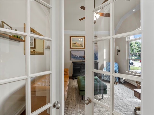 interior space with ceiling fan and french doors