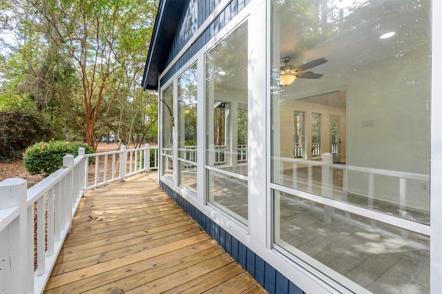 deck featuring a sunroom and ceiling fan