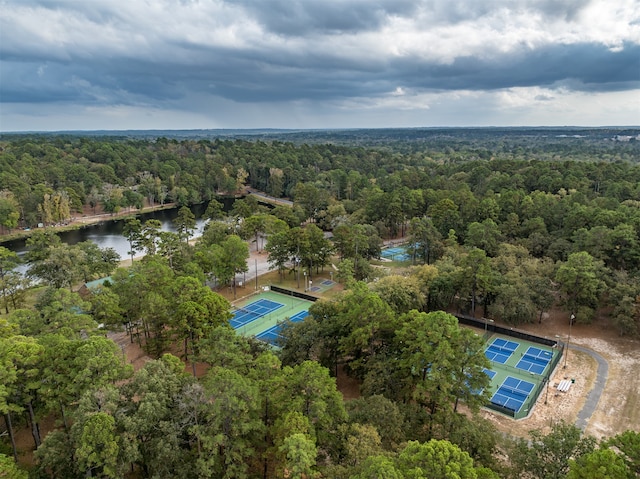 aerial view with a water view and a forest view