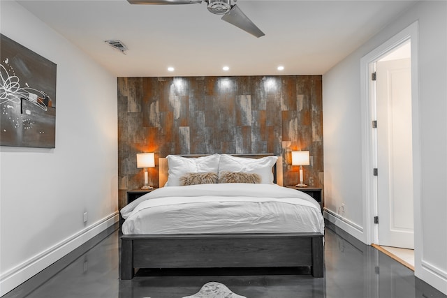 bedroom featuring ceiling fan and concrete flooring