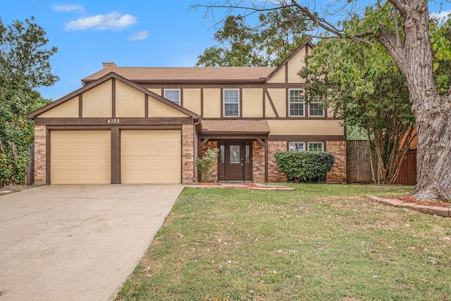 tudor-style house with a front yard and a garage