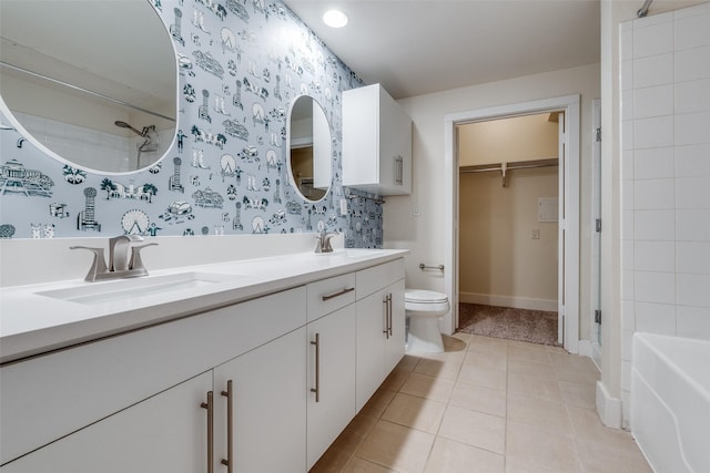 bathroom featuring tile patterned flooring, vanity, and toilet