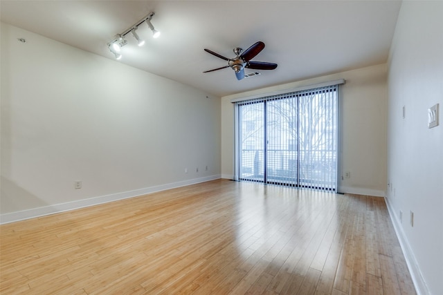 unfurnished room featuring light hardwood / wood-style floors, track lighting, and ceiling fan