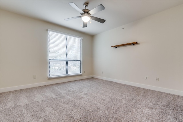 unfurnished room with ceiling fan and carpet floors