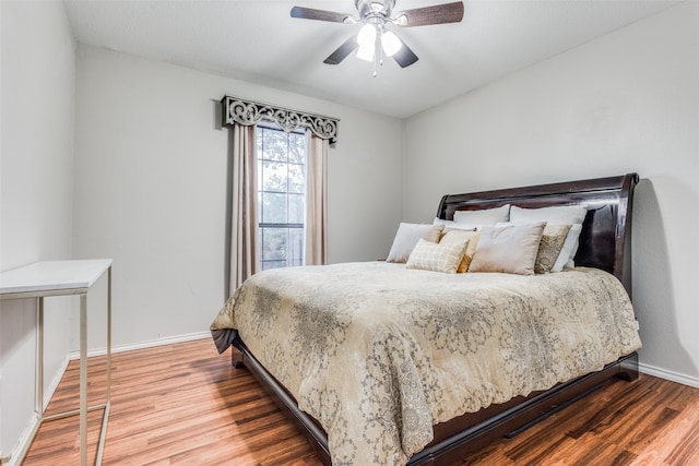 bedroom with hardwood / wood-style flooring and ceiling fan