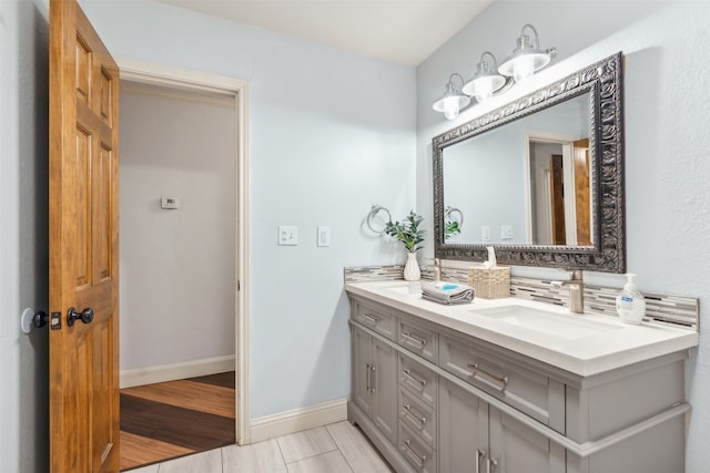 bathroom with vanity and hardwood / wood-style flooring