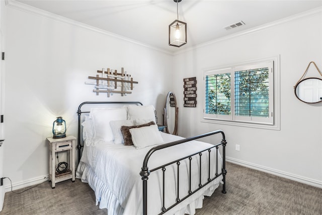 bedroom with ornamental molding and carpet flooring