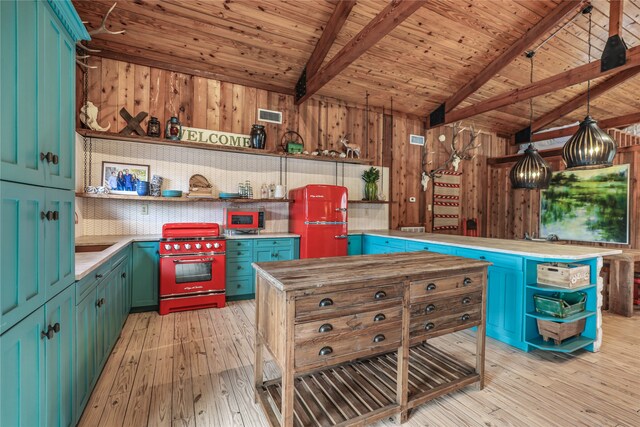 interior space with vaulted ceiling with beams, wooden walls, and light wood-type flooring