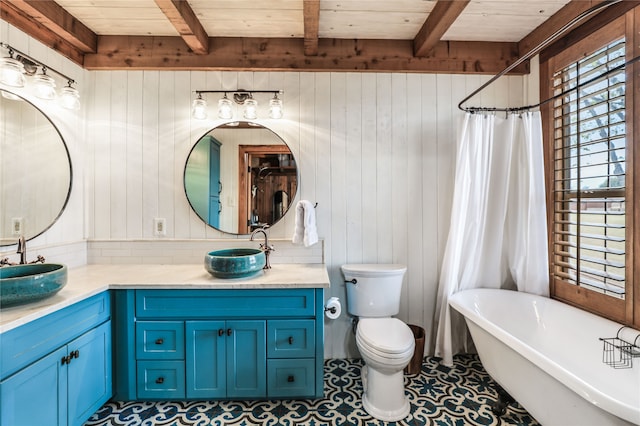 bathroom with vanity, wood walls, beamed ceiling, and a washtub