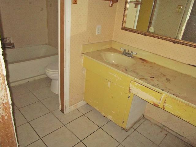 bathroom featuring tile patterned flooring, vanity, and toilet