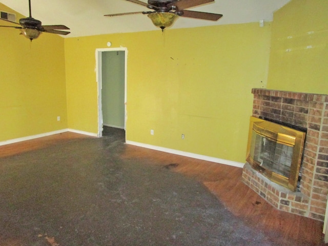 unfurnished living room with a fireplace and ceiling fan