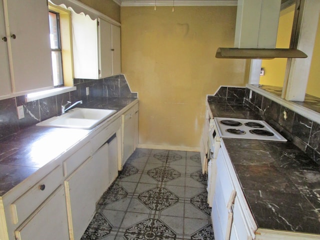 kitchen with white cabinetry, sink, backsplash, white appliances, and ornamental molding