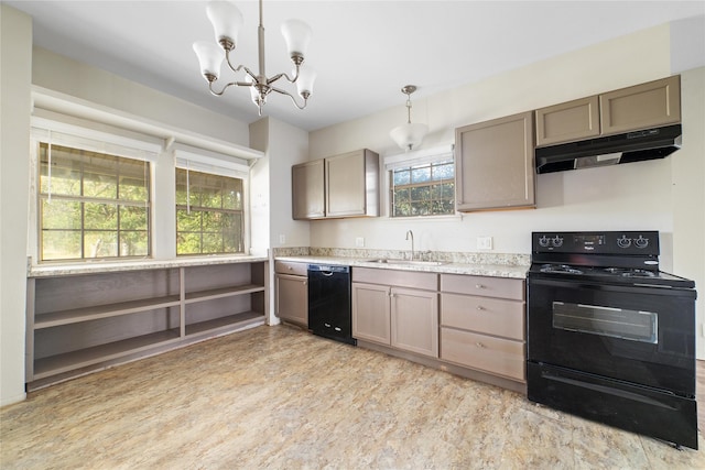 kitchen with a sink, black appliances, under cabinet range hood, light countertops, and a chandelier