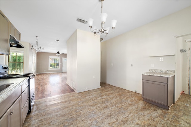 kitchen featuring stainless steel electric stove, light wood-type flooring, visible vents, under cabinet range hood, and a notable chandelier