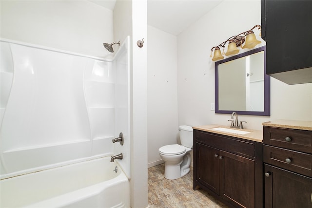 full bathroom with toilet, baseboards, vanity, and bathtub / shower combination