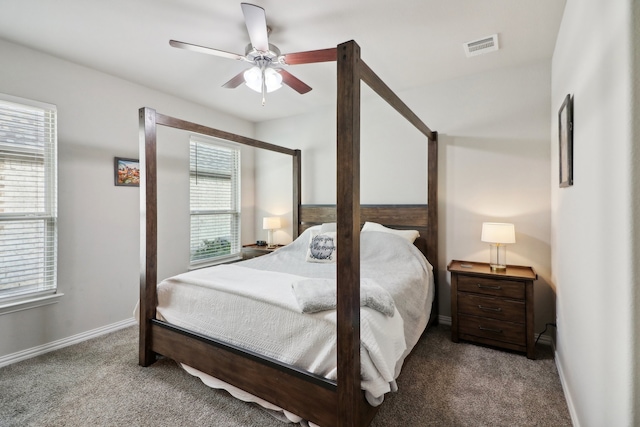 bedroom with carpet flooring, multiple windows, and ceiling fan